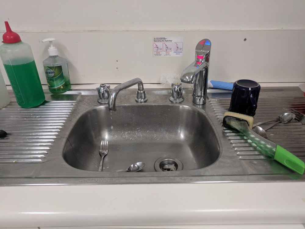Kitchen sink tapware and boiling water unit being serviced
